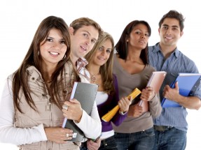 happy group of students with notebooks - isolated over a white background